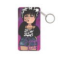 Keychain with a colorful design of a person wearing a cow print top and denim jacket on a purple background.